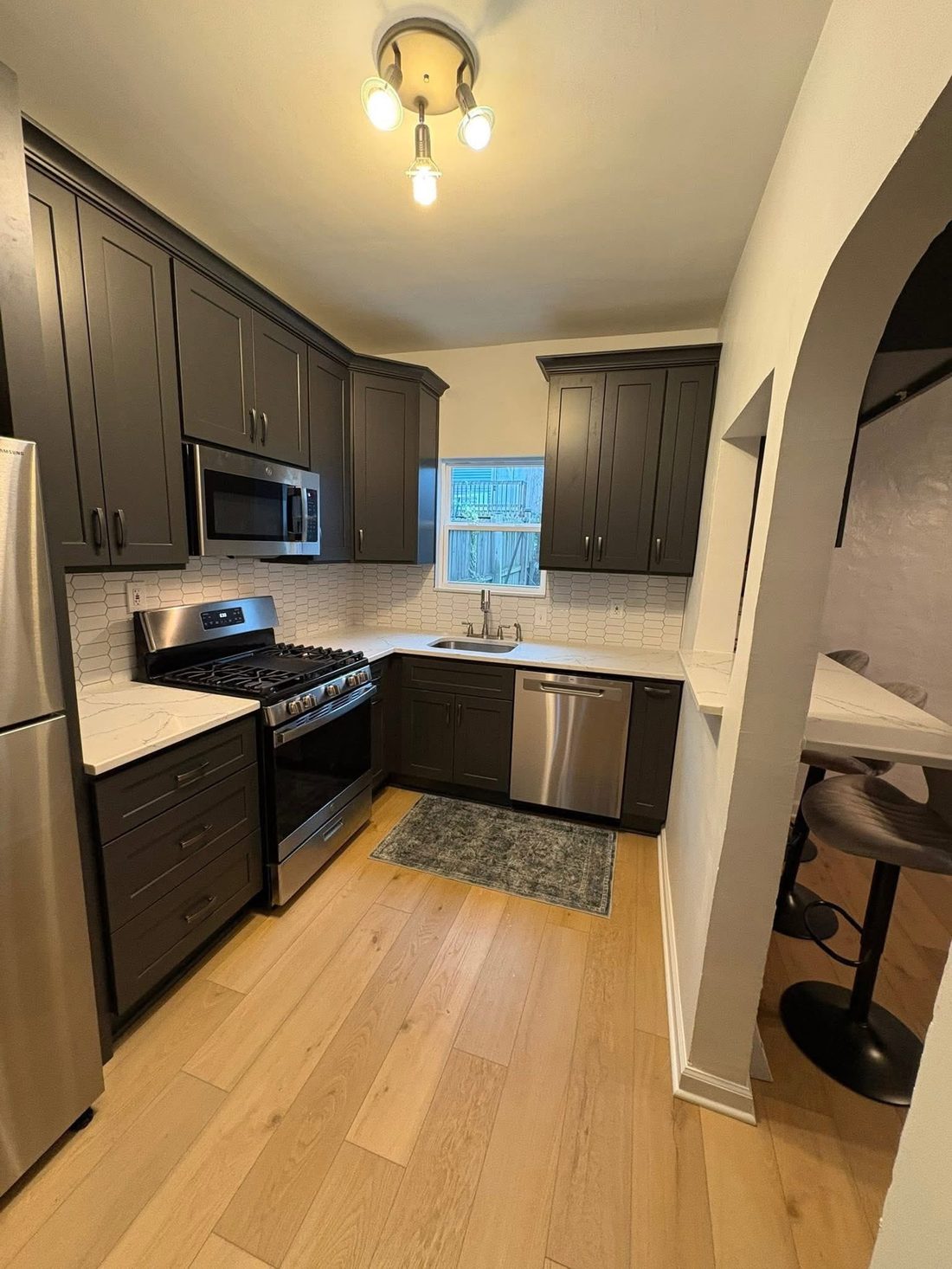Espresso kitchen with arched pass-through