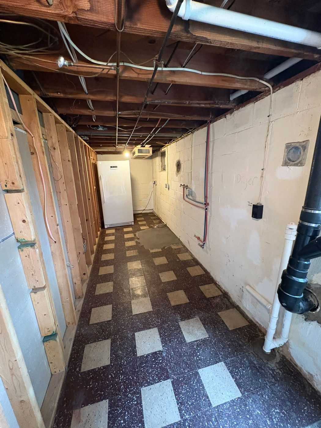 Unfinished basement with exposed joists