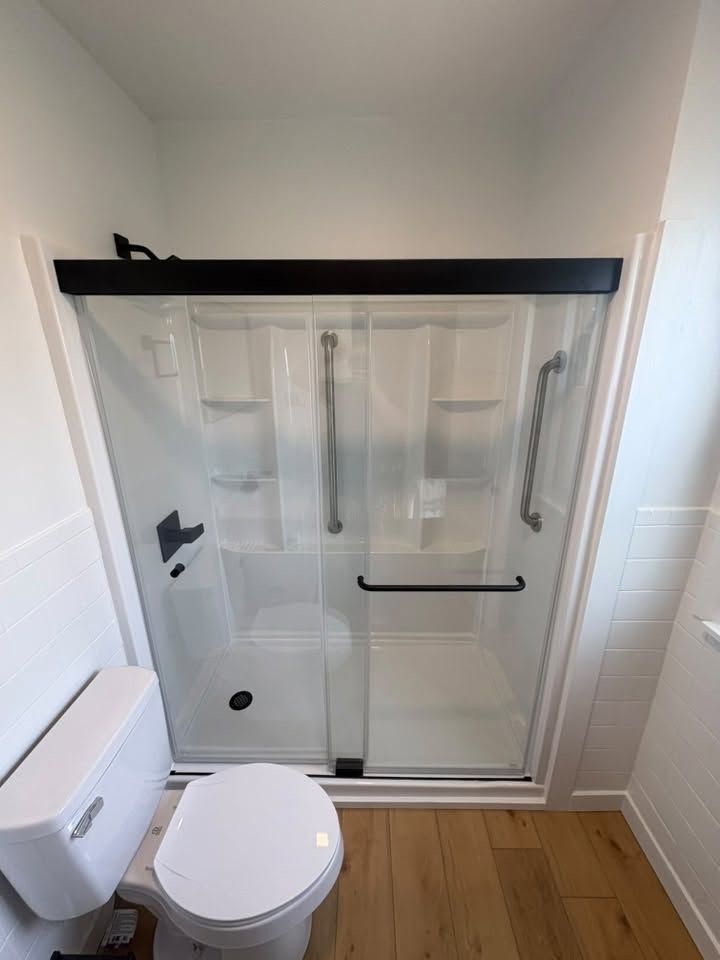 Remodeled bathroom with glass shower door
