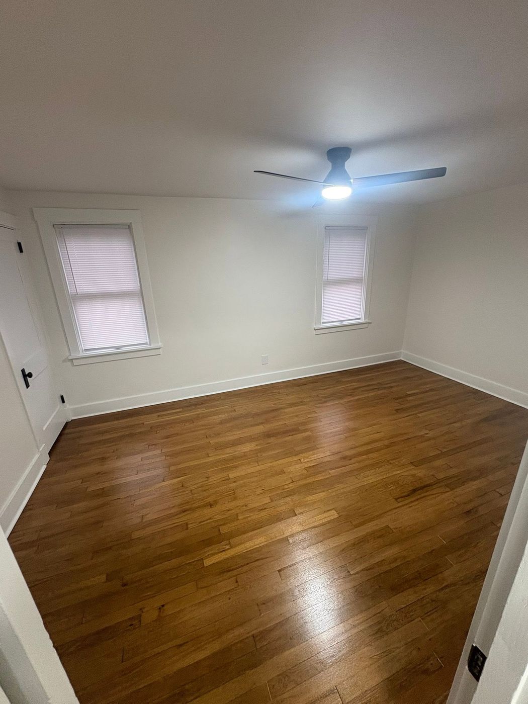 Bedroom with refinished oak floors